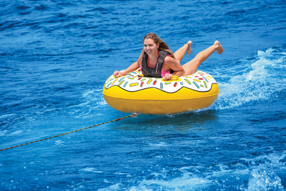 Bill's Exhausts AIRHEAD Sports Group Donut Townut water towable boat float on water with bright colors and inflatable design.