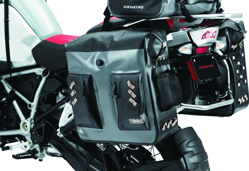 Kuryakyn Torke 24L dry bag panniers for waterproof PowerSports storage, shown mounted on a motorcycle.