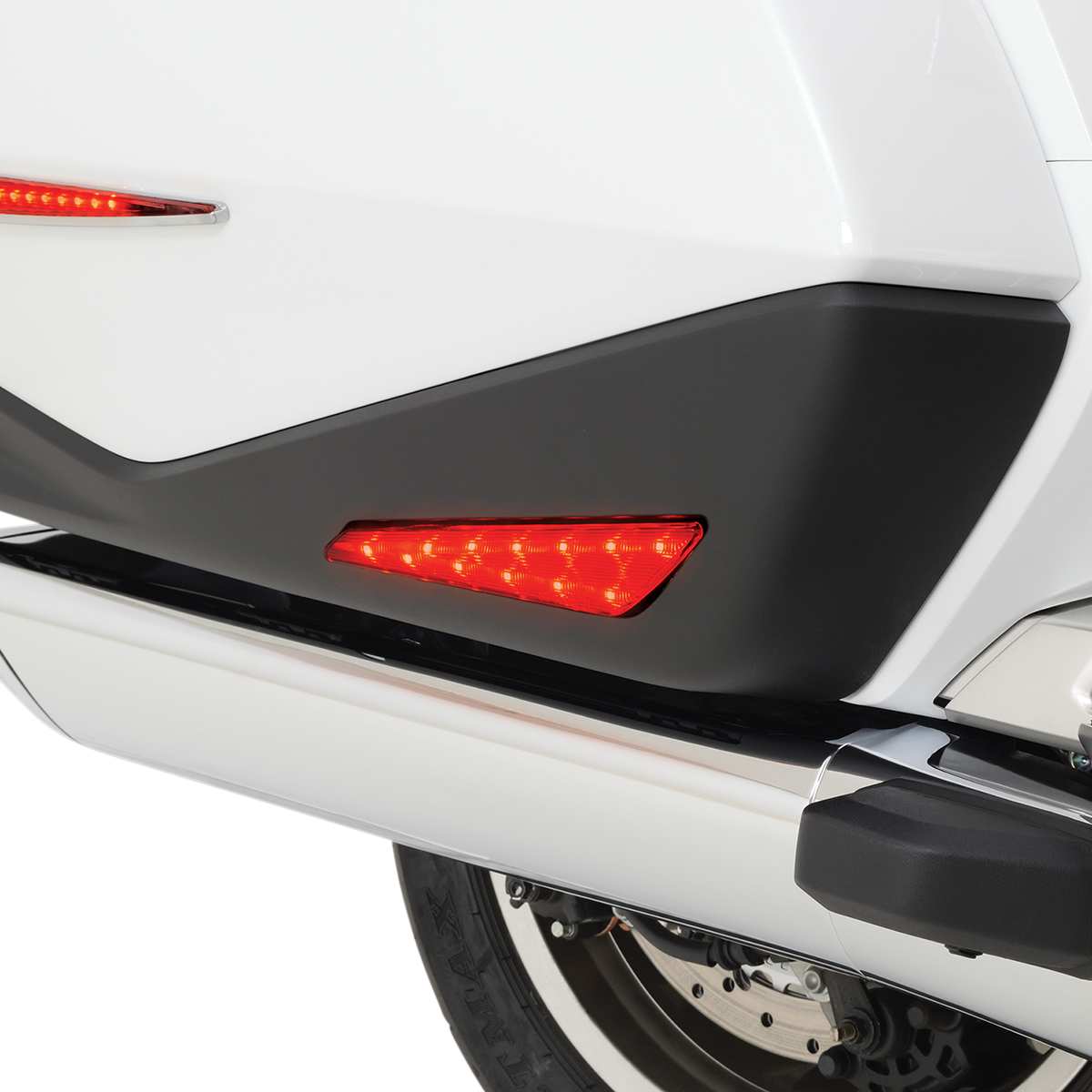 Red SHOW CHROME Marker Lights for GL1800 engine by Bill's Exhausts, close-up view of the red indicator lights on motorcycle engine.