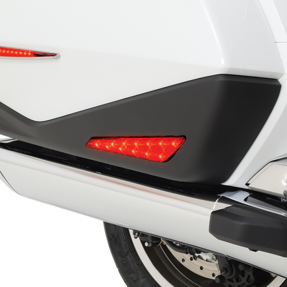 Red SHOW CHROME Marker Lights for GL1800 engine by Bill's Exhausts, close-up view of the red indicator lights on motorcycle engine.