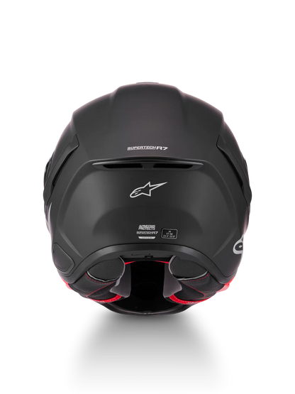 Alpinestars R7 Solid helmet with ECE 22.06 and DOT certification, shown from the front view in black with sleek design.