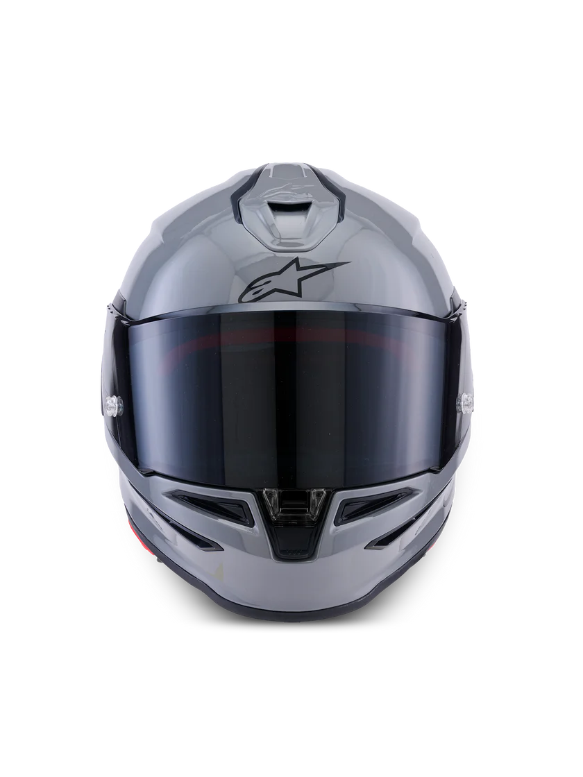 Alpinestars R7 Solid helmet with sleek design, showing the helmet's front view and certification labels.