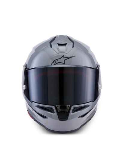 Alpinestars R7 Solid helmet with sleek design, showing the helmet's front view and certification labels.