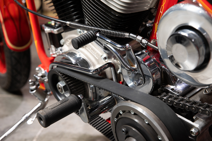 Black BILTWELL Norman foot pegs for motorcycles, shown with metal mounting brackets and textured surfaces for grip.