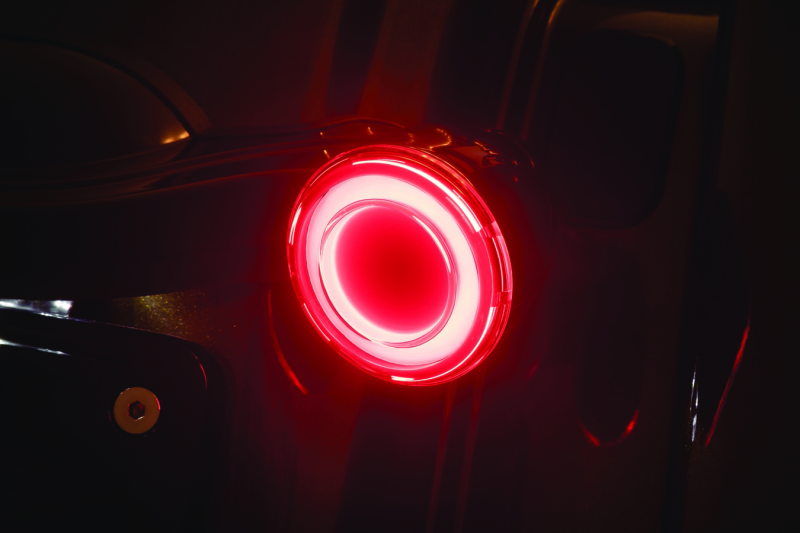 Kuryakyn Tracer LED Rear Turn Signal Insert for Harley Davidson Road King Special motorcycle, showing illuminated red LEDs inside the housing