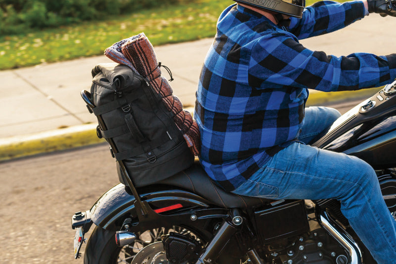 Kuryakyn Momentum Freeloader Duffle for Powersports, quick-mount sissy bar bag on motorcycle with black durable fabric and straps.