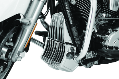 Chrome Kuryakyn oil cooler cover for Harley Davidson Touring models, with detailed chrome finish and branding visible.