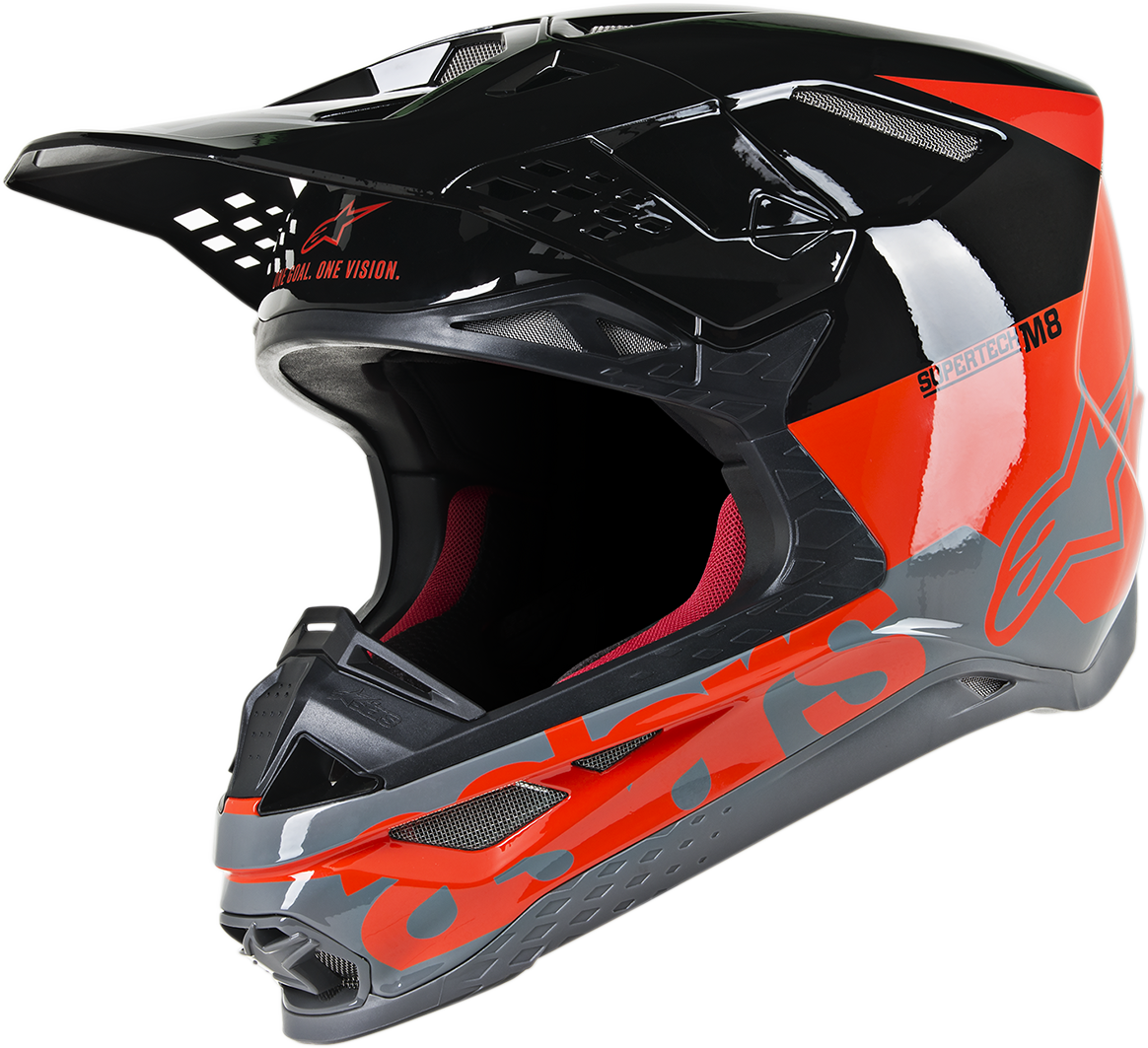 Alpinestars Supertech M8 helmet in Radium Red Fluo, black and gray glossy, showing the aerodynamic design and MIPS safety features.