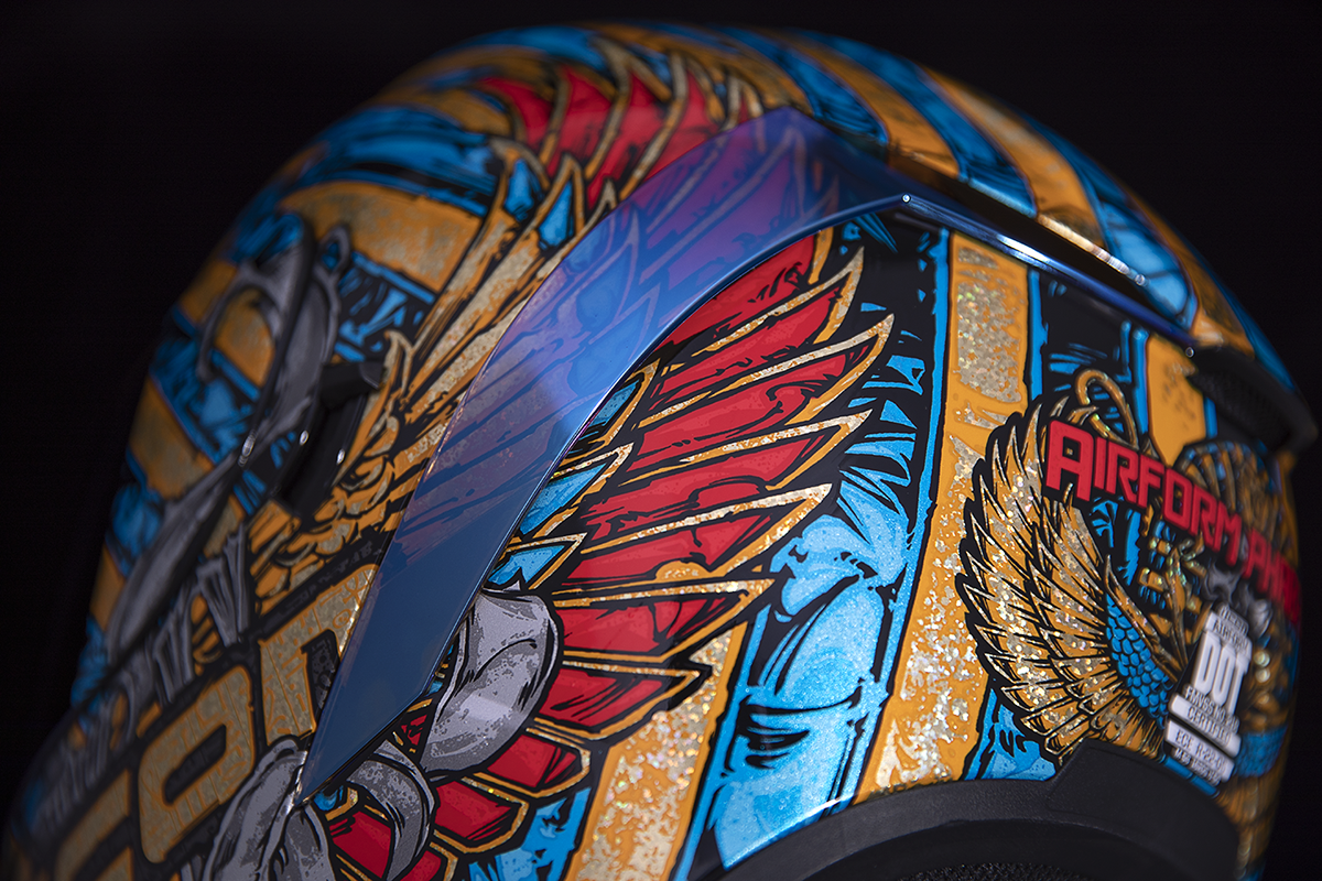 Bill's Exhausts ICON Airform Pharaoh Gold XL helmet with sleek design and detailed graphics, shown in a close-up image.