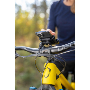 Bill's Exhausts SP CONNECT 52300 phone mount attached to a motorcycle handlebar, showcasing secure smartphone attachment.
