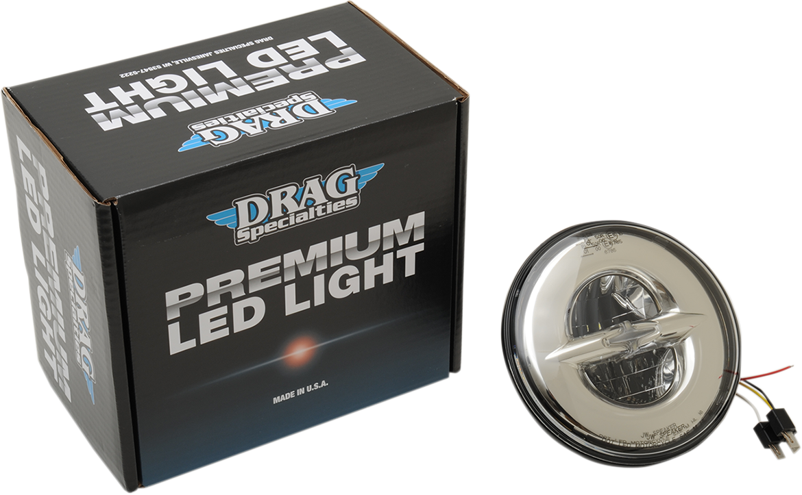 Chrome 7-inch reflector-style headlight by Drag Specialties with a sleek, round design for motorcycle front lighting.
