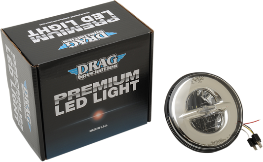 Chrome 7-inch reflector-style headlight by Drag Specialties with a sleek, round design for motorcycle front lighting.