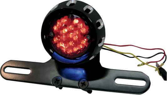 Dual-function LED taillight and license plate mount for Harley FXD and XL models by Drag Specialties, with sleek black finish.