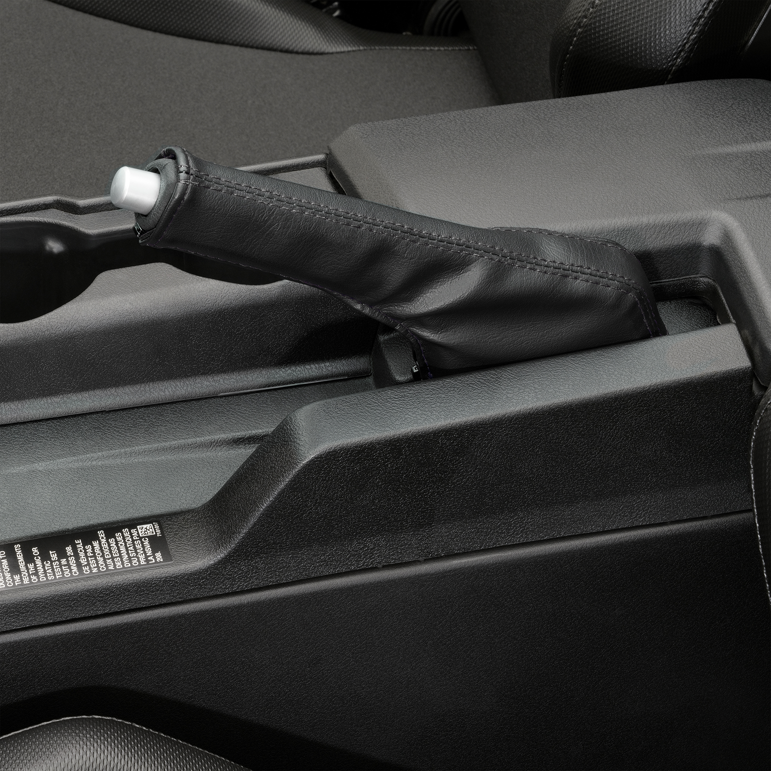 Black stitched SHOW CHROME cover for E-brake on Slingshot engine, designed by Bill's Exhausts.