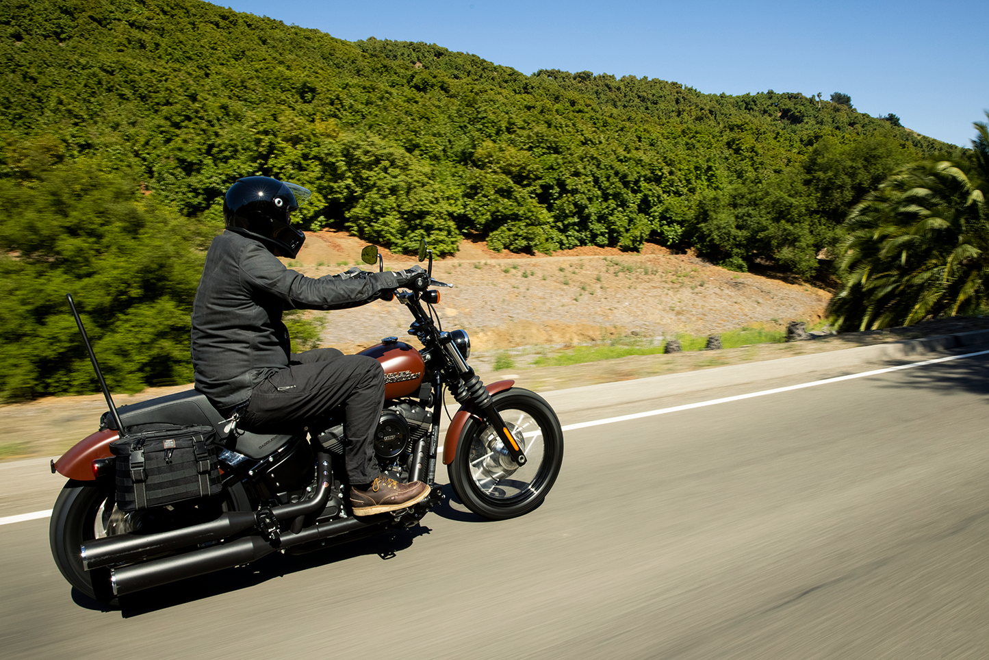 Black Biltwell Exfil-18 Saddlebags for motorcycle, durable bag with sleek design, mounted on a bike.