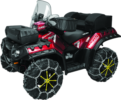 QuadBoss XL tire chain with V-Bar design fitted on large tires, providing enhanced traction and durability for off-road or snowy conditions.