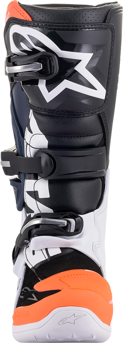 Alpinestars Youth Tech 7S motorcycle boots in black, orange, and white with robust protective features and secure straps.