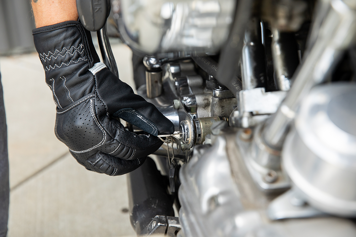 BILTWELL Borrego motorcycle gloves in black and cement, medium size, with protective padding and textured grip details.