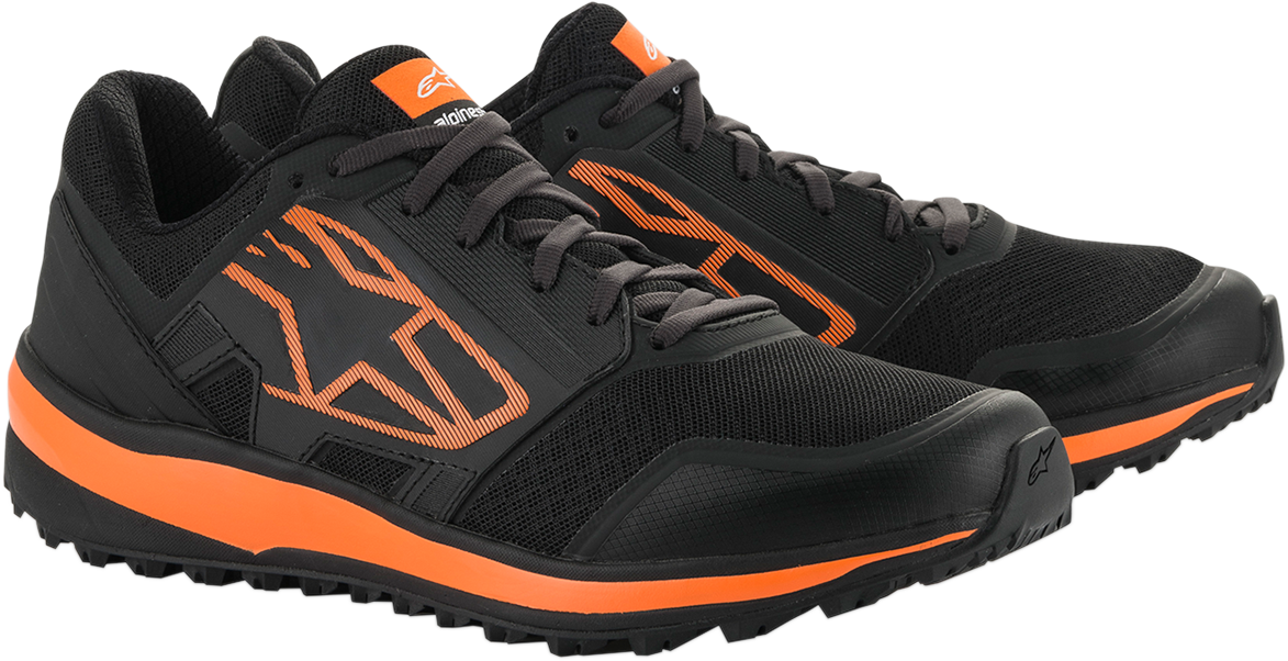 Alpinestars Meta Trail shoes in black and orange with rugged sole, designed for outdoor trail riding, US size 9.