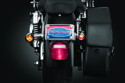 Chrome Kuryakyn license plate turn signal and marker light mount for motorcycle, featuring sleek design and durable construction.