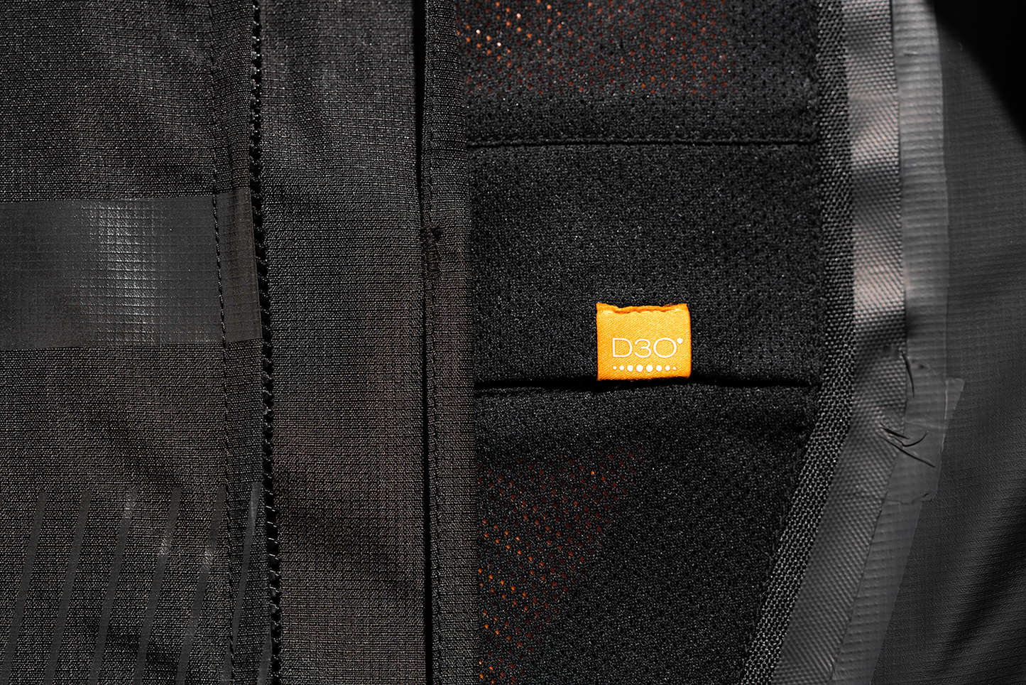 Black ICON PDX3™ Jacket in XL size, displayed on a hanger, showing its sleek design and high-quality fabric.