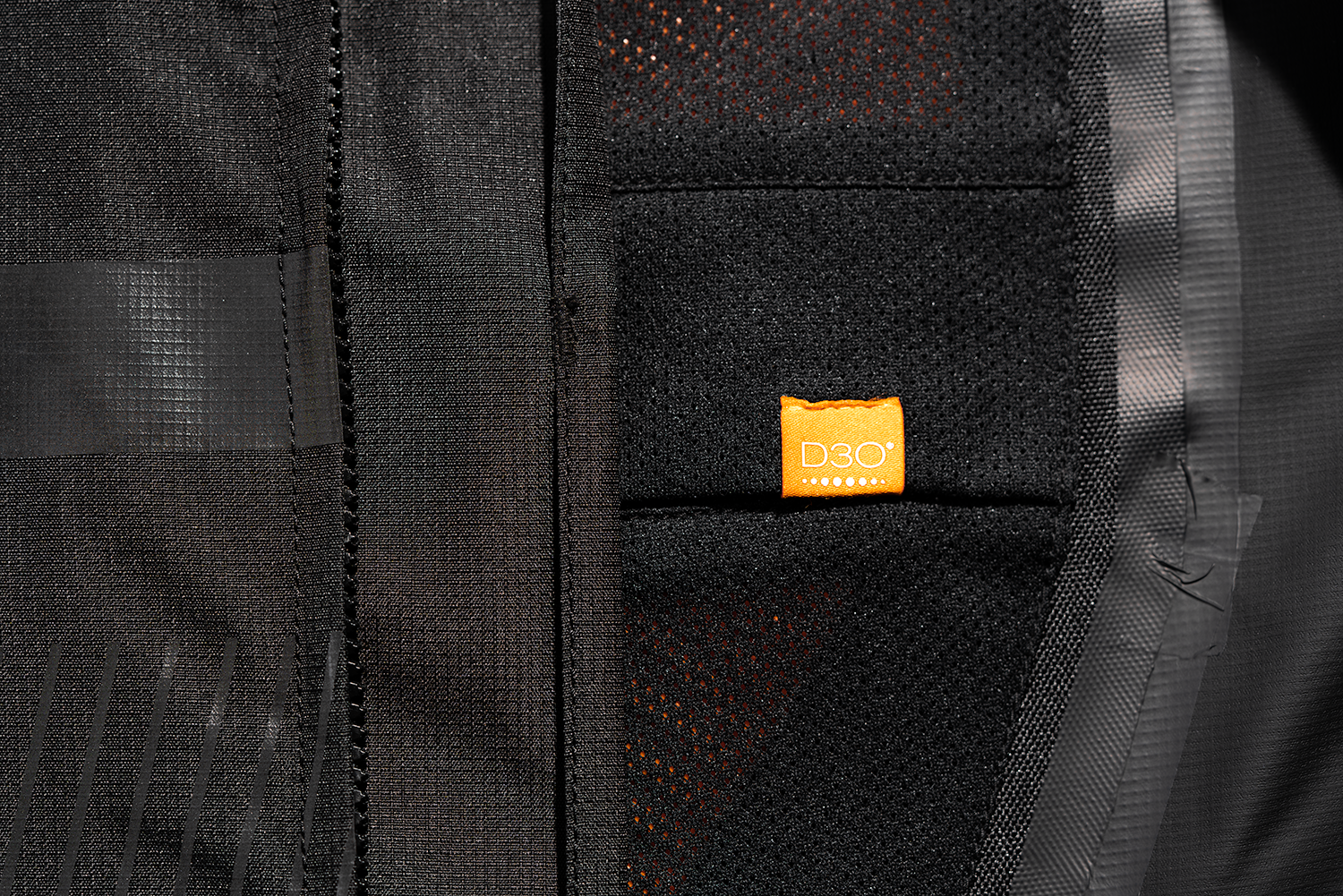 Black ICON PDX3™ Jacket in XL size, displayed on a hanger, showing its sleek design and high-quality fabric.