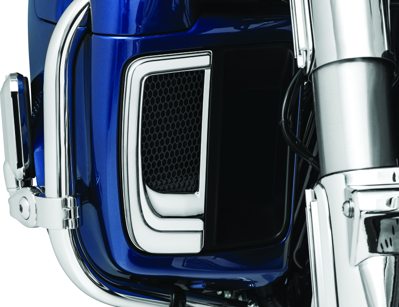 Chrome Kuryakyn Tracer Lower Fairing Grill installed on Harley Davidson Touring motorcycle, showcasing sleek design and fit.