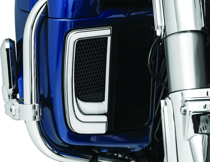 Chrome Kuryakyn Tracer Lower Fairing Grill installed on Harley Davidson Touring motorcycle, showcasing sleek design and fit.