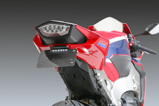 YOSHIMURA V2 Fender Eliminator Kit for Honda motorcycle, showing sleek black metal design with mounting brackets and license plate holder.