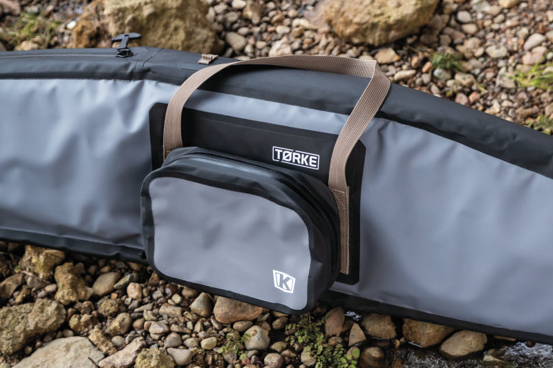 Kuryakyn Torke large removable dry pouch with waterproof design and MOLLE compatibility, shown attached and open on a motorcycle.