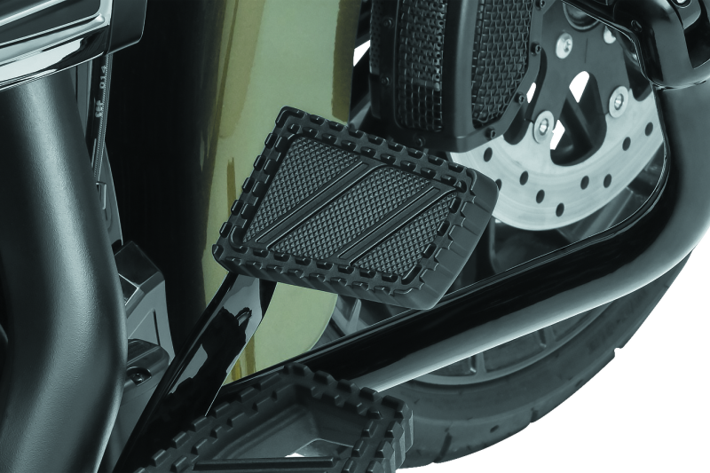 Kuryakyn Riot brake pedal pad for Harley Davidson FL motorcycles, durable aluminum with serrated traction top surface.