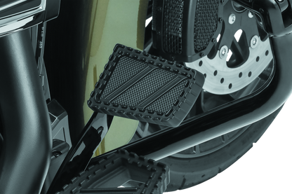 Kuryakyn Riot brake pedal pad for Harley Davidson FL motorcycles, durable aluminum with serrated traction top surface.