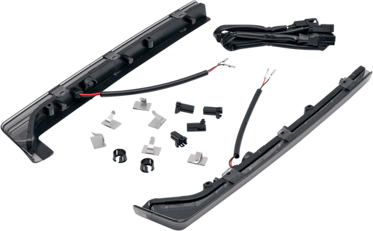DRAG SPECIALTIES Smoke Lens Side Light Kit showing black smoke-tinted lens and chrome mounting hardware on a motorcycle side light.