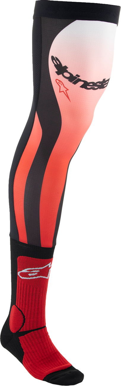 Alpinestars black and red knee brace socks in large/XL size, showing a close-up of the breathable fabric and reinforced areas.