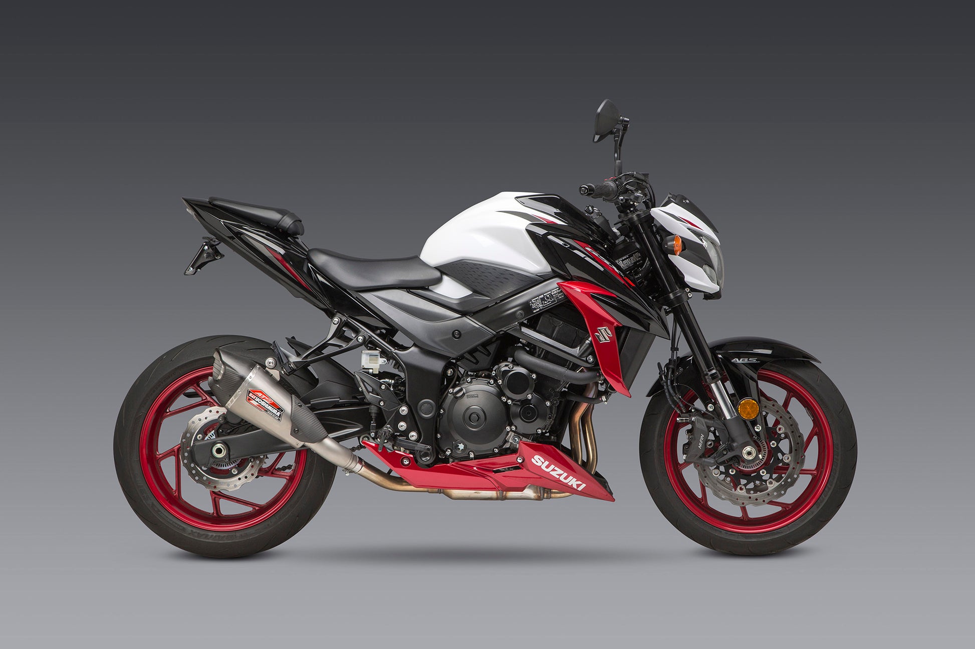 YOSHIMURA Street AT2 slip-on exhaust with carbon fiber end cap and works finish for motorcycles.