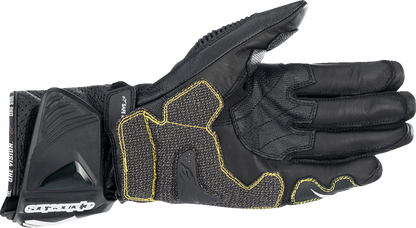 Alpinestars GP Tech V2 S motorcycle gloves in black and white, size 3XL, showing reinforced knuckles and textured palm design.