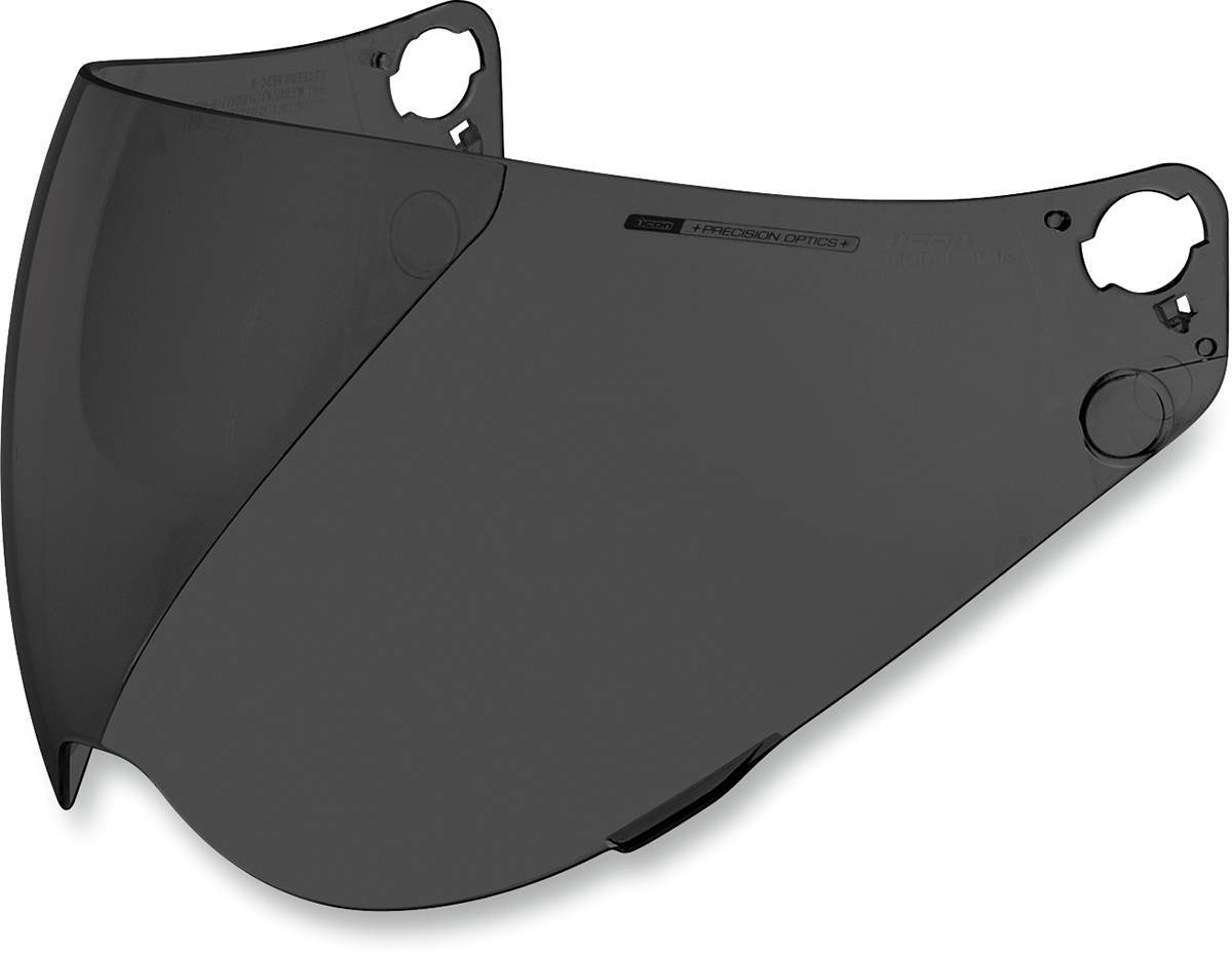 Dark smoke ICON Variant™ Optics™ shield for helmets, showing tinted, curved visor with reflective finish.