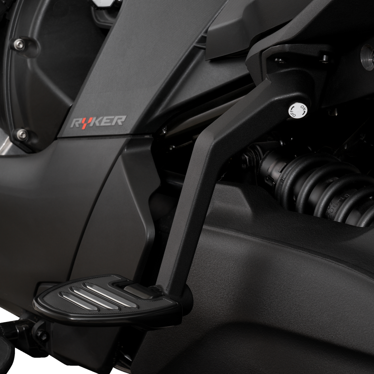 Show Chrome adjustable passenger boards attached to a motorcycle engine, designed for easy passenger comfort and style.