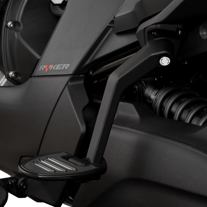 Show Chrome adjustable passenger boards attached to a motorcycle engine, designed for easy passenger comfort and style.