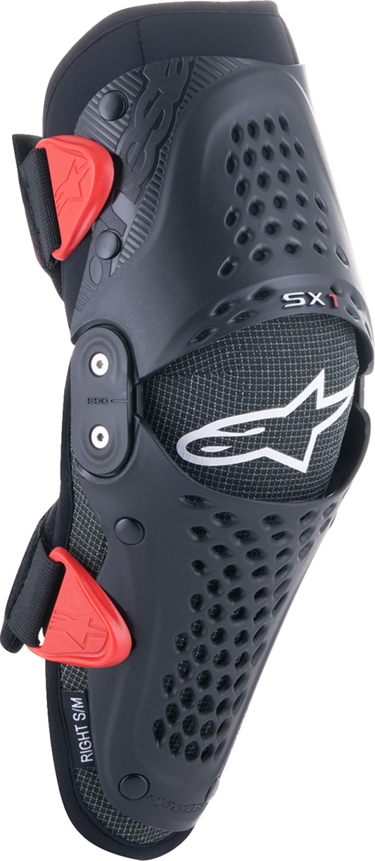 Youth ALPINESTARS SX-1 Knee Protectors in black and red, small/medium size, designed for protective gear for young riders.