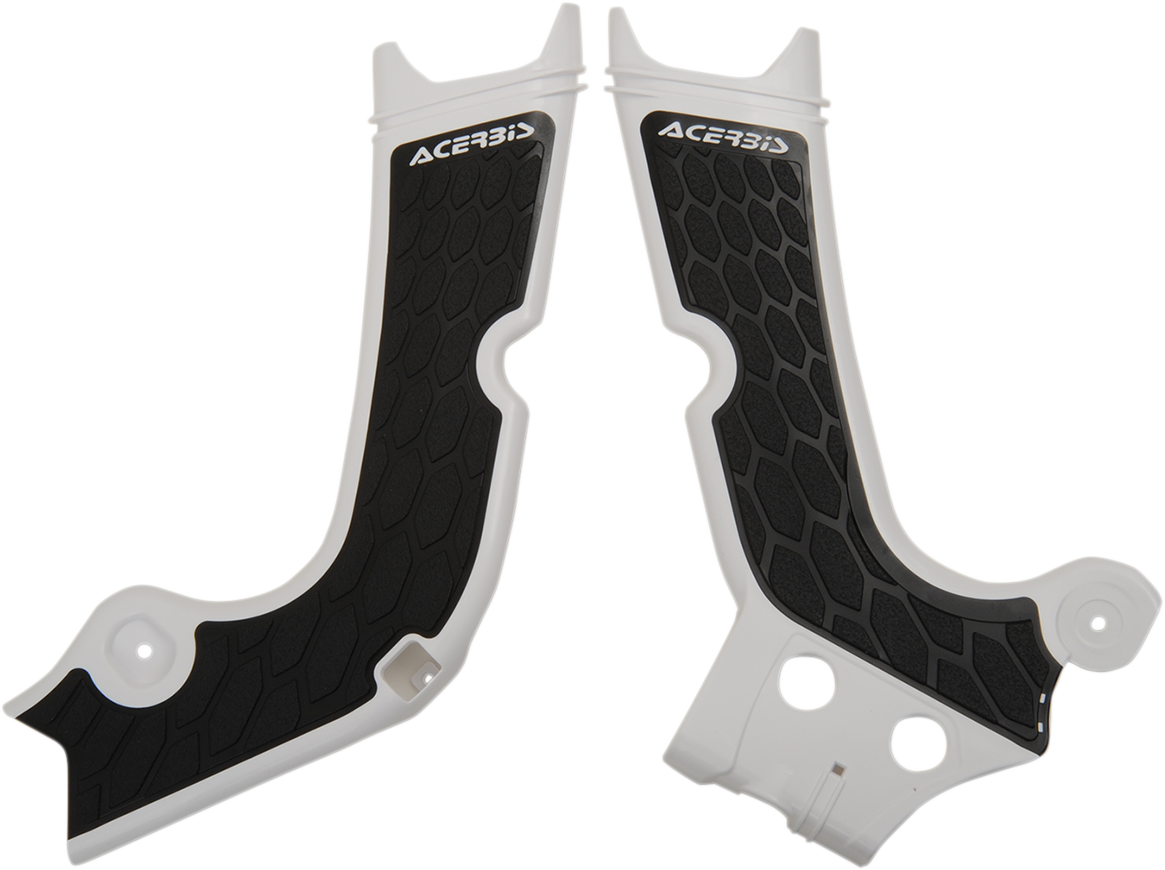 Acerbis X-Grip Frame Guards in white and black installed on a motorcycle frame for protection.