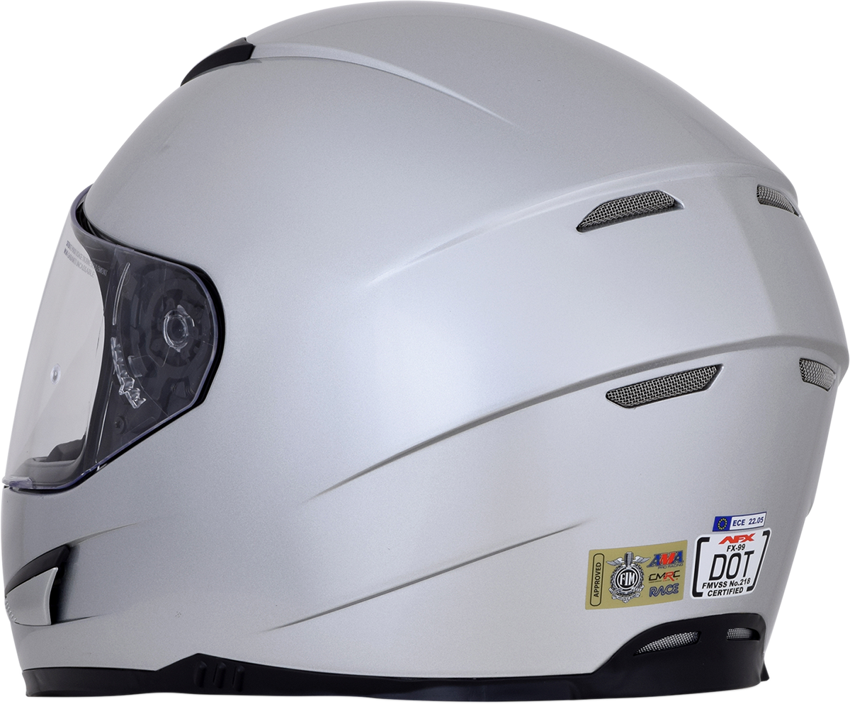 Silver AFX FX-99 motorcycle helmet with XS size, featuring a sleek design and clear visor.