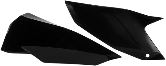 Black Acerbis side panels for motorcycle body, shown on a bike, with textured surface and mounting points visible.