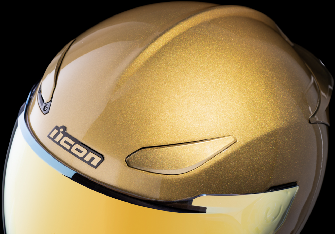 ICON Domain Cornelius helmet in gold, small size, featuring sleek helmet design with detailed graphics and ventilation.
