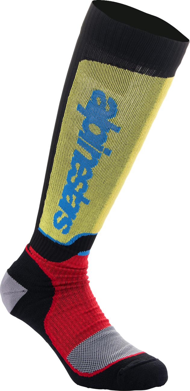 Alpinestars MX Plus motocross socks in black, red, yellow, and blue with reinforced areas for motocross riding.