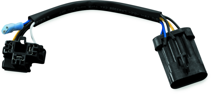 Kuryakyn headlamp adapter harness for H4 LED headlights on Harley Davidson Touring models, shown connected to motorcycle headlight.