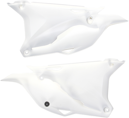A set of white ACERBIS side panels for motorcycle body, featuring sleek design and brand-specific details.