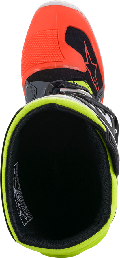 Alpinestars Youth Tech 7S motorcycle boots in black, gray, red, white, and yellow with straps and protective features.