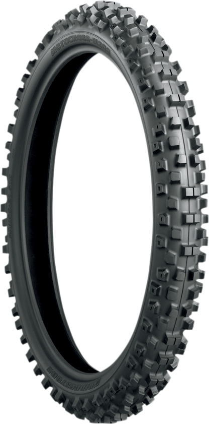 Bridgestone M203 front motorcycle tire 70/100-19, 57M with tread pattern designed for performance and grip.
