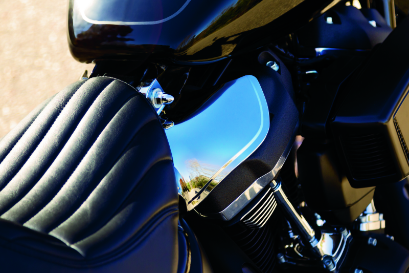 Kuryakyn Saddle Shields heat deflectors installed on a 2018 Harley Davidson Softail motorcycle for rider comfort.
